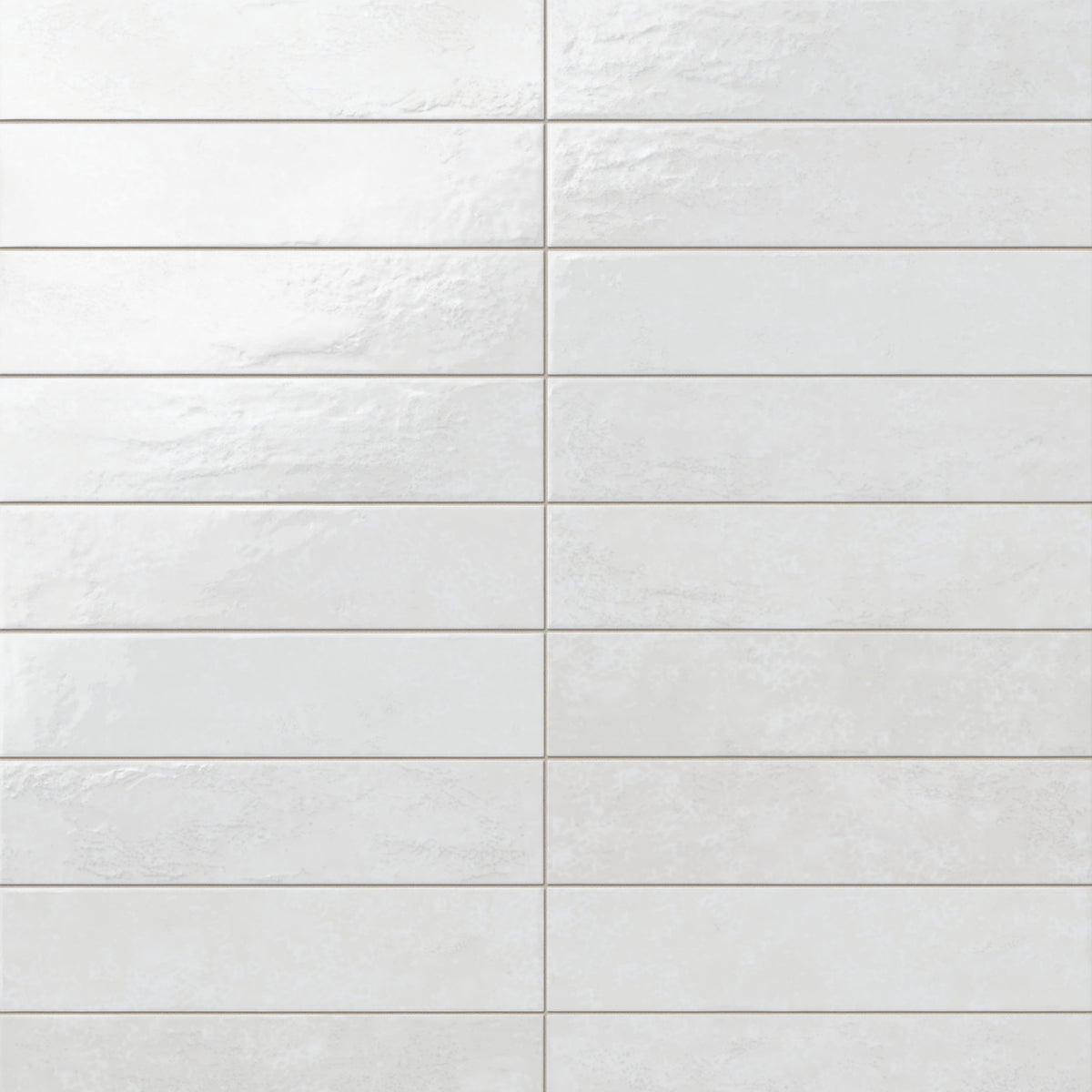 Inspired by Mediterranean design, these glossy white porcelain tiles feature gentle surface variation and a luminous finish that suits coastal, spa-like, and relaxed modern spaces.