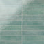 Featuring a glossy, artisan-inspired finish, this seafoam porcelain tile moves between soft blue-greens and weathered hues, bringing a relaxed coastal feel to kitchens and baths.