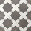 Dark gray and white Aslan 6x12 porcelain tiles in star and cross shapes show gentle veining across a matte finish and softened edges, perfect for kitchens or accent walls.