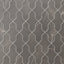 Shield-shaped Aslan 2x8 porcelain tiles in dark gray create a rhythmic layout, featuring subtle veining, a matte surface, and gently softened edges.