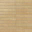 A modern porcelain subway tile in yellow-orange features subtle surface variation and a powdery matte glaze, adding warmth and quiet texture to interior walls.