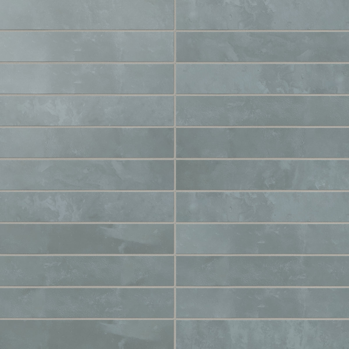 Blue porcelain modern subway tiles show shifting, earth-drawn tones with a powdery matte glaze, giving the wall a relaxed, grounded look that feels easy on the eye.