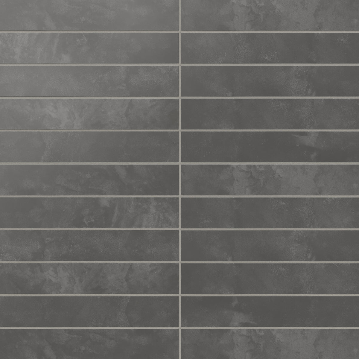 This modern dark gray porcelain subway tile carries subtle, earth-inspired shading and a soft powdery finish, bringing depth and balance to contemporary wall spaces.