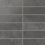 Dark gray 2x6 matte subway tiles show shifting, earth-drawn tones across the surface, laying out in a calm horizontal rhythm that suits kitchens and baths.