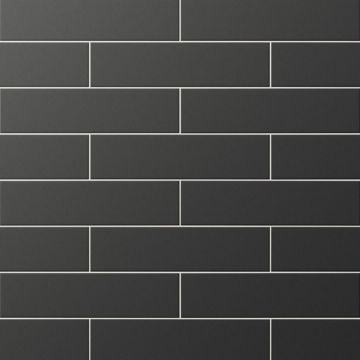 Matte black subway tiles in a staggered layout, delivering bold contrast and modern elegance to walls or backsplashes.