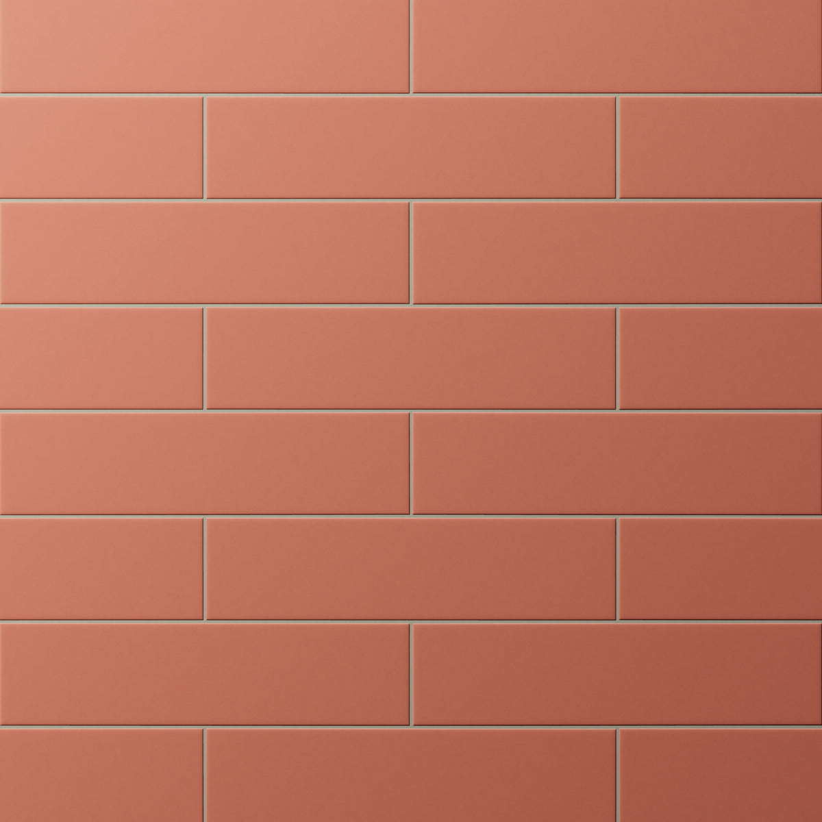 Matte subway tiles with earthy red hue in a classic offset layout, adding warmth and rustic charm to walls or backsplashes.