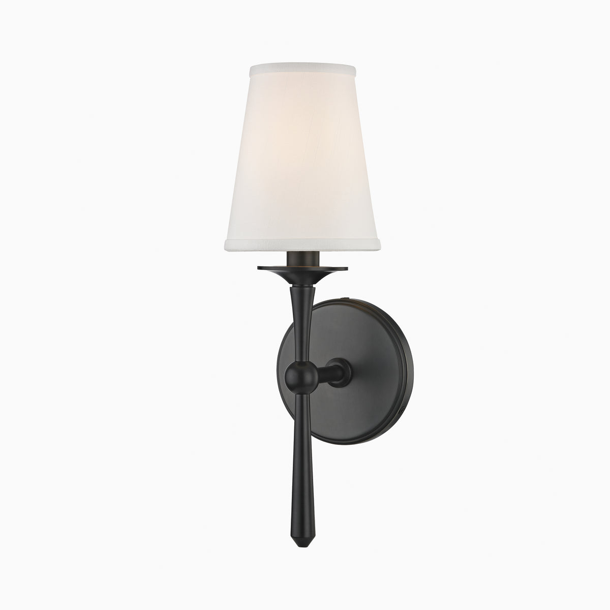 Matte black wall sconce with tapered white fabric shade and slender stem, offering a bold take on traditional elegance