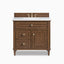 Elodie 36-inch single vanity in mid-century walnut with White Zeus quartz countertop, featuring a center sink, paneled cabinet doors, and brass hardware.