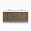 A soft Whitewashed Walnut finish highlights the Janelle 72 inch double vanity with framed cabinet panels, storage drawers, and a White Zeus quartz top with dual sinks.