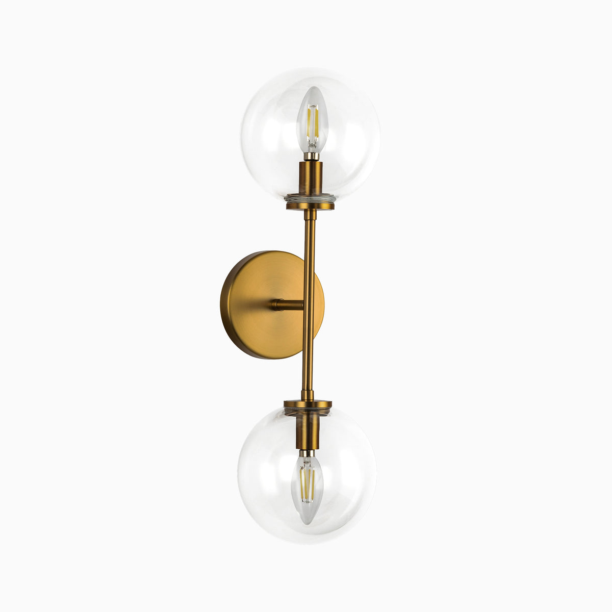 Modern wall sconce with dual clear glass globe shades and brushed brass vertical metal arm.