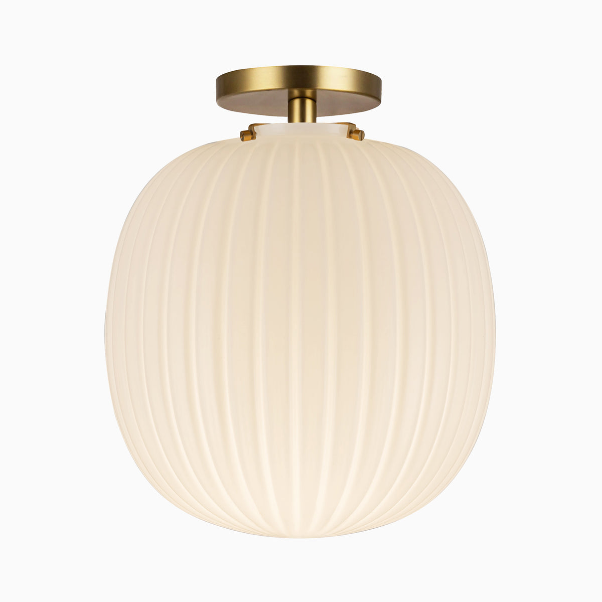Flush mount ceiling light with a brushed gold canopy and glossy ribbed opal glass globe shade.