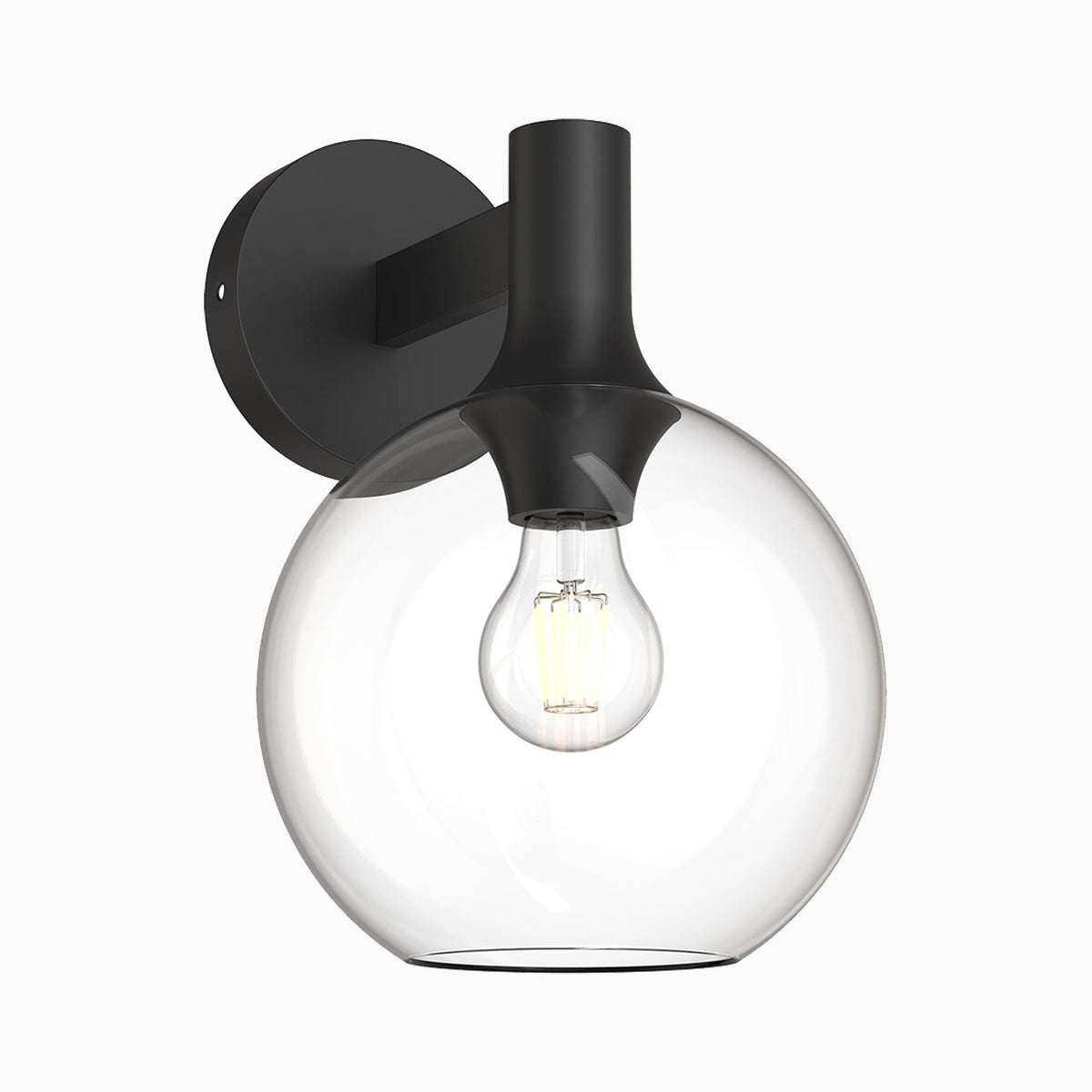 Wall sconce with clear glass globe shade and matte black backplate and arm.