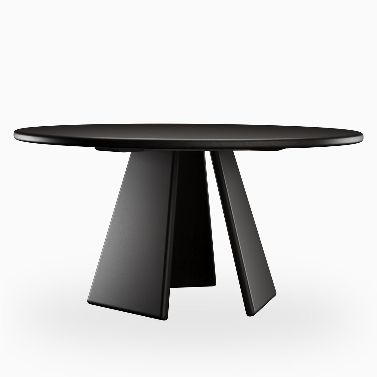 Round black dining table with a smooth rounded tabletop and three angled pedestal legs, presenting a bold sculptural form with a sleek modern finish.