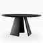 Round black dining table with a smooth rounded tabletop and three angled pedestal legs, presenting a bold sculptural form with a sleek modern finish.