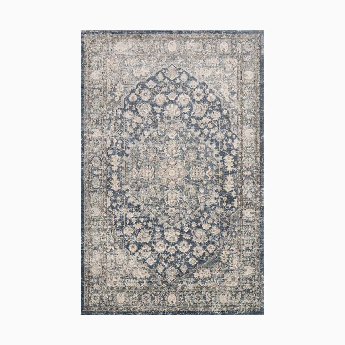 Power loomed area rug made of polypropylene and polyester, featuring an intricate medallion design in distressed blue and ivory tones, exuding timeless elegance.
