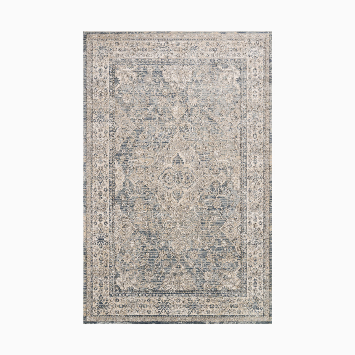 Power loomed area rug made of polypropylene and polyester, featuring an intricate distressed medallion pattern in muted blue and beige tones for timeless elegance.
