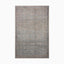 Intricate Persian-inspired power loomed rug made of polyester with a distressed floral pattern in muted blues, greens, and beige, offering a timeless vintage charm.