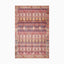 Bohemian-style power loomed rug made of polyester, featuring a vibrant diamond pattern in rich red, navy, and gold tones, creating a warm, eclectic look.