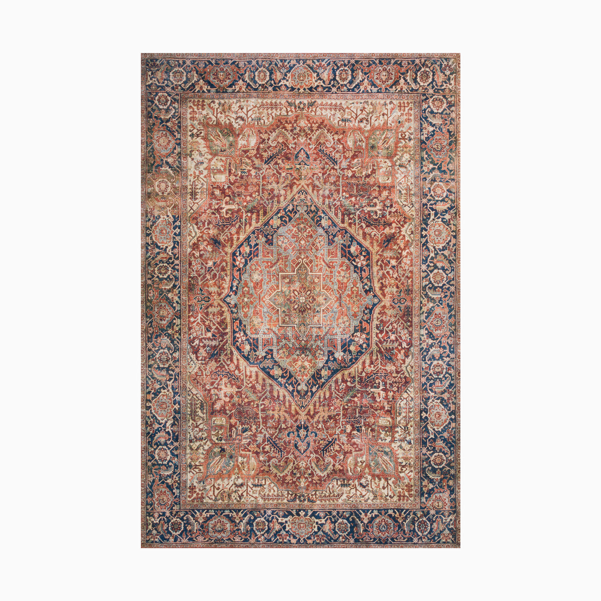 Vintage-style power loomed rug made of polyester with an intricate medallion design in warm rust, beige, and deep navy tones, framed by an ornate floral border.