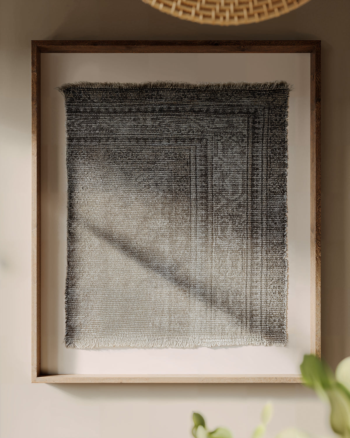 Hearthline wall art in a wood frame, showcasing distressed textile patterns in layered gray tones with subtle fading and textured depth.