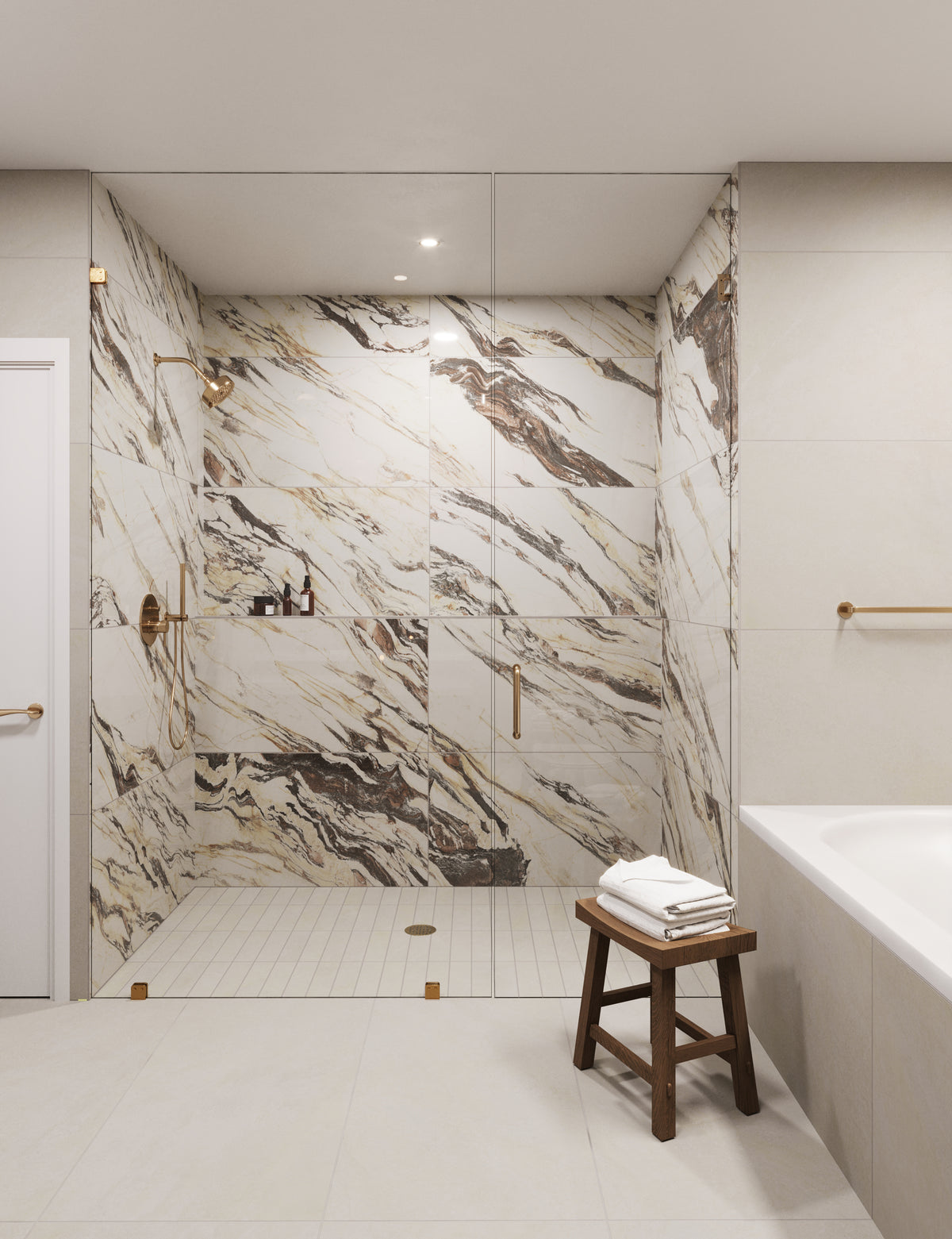 Luxurious bathroom featuring dramatic marble-patterned tiles in the shower area, complemented by soft beige floor tiles and gold accents.