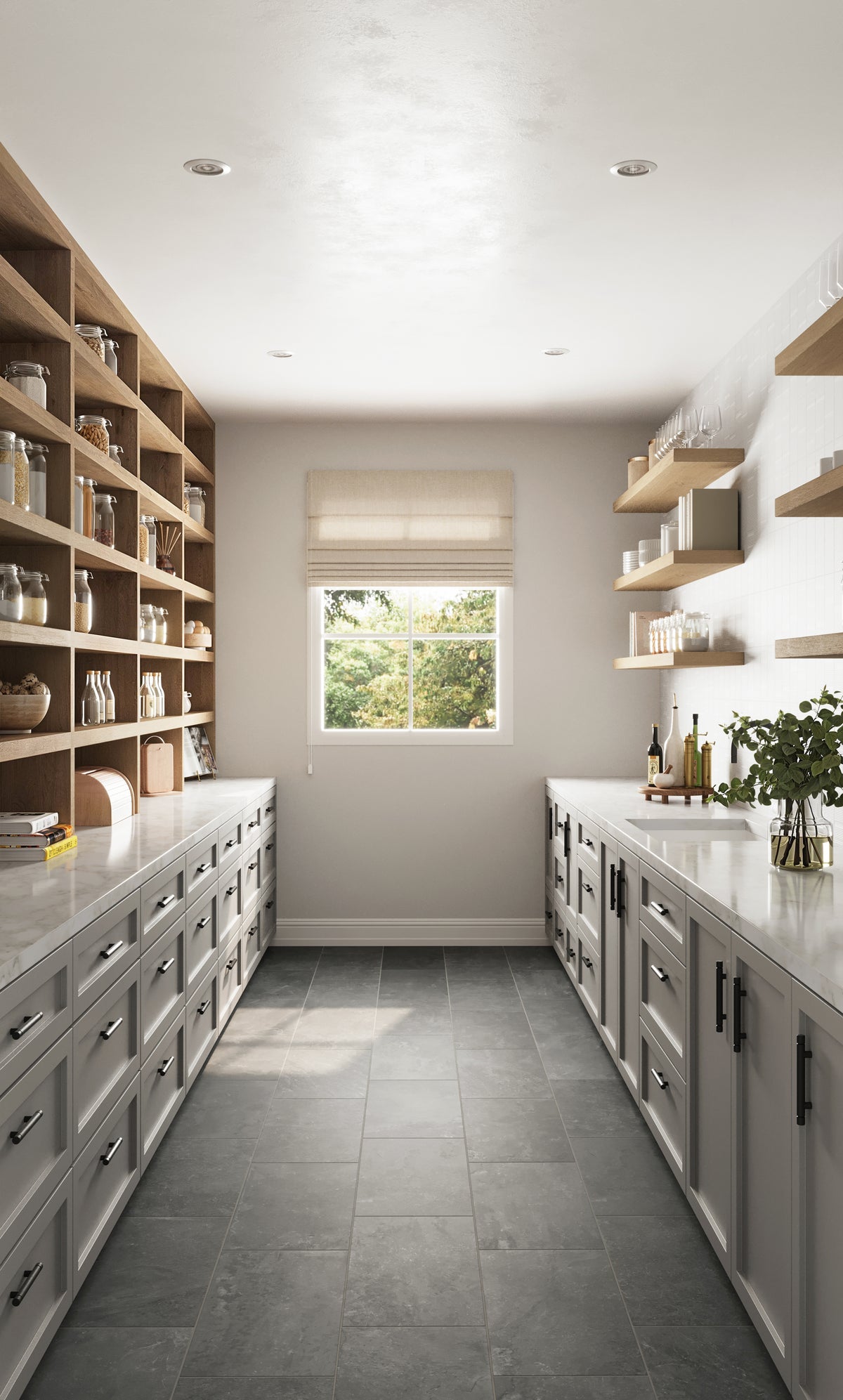 Bright and airy pantry featuring Wren 12x24 matte porcelain tiles in charcoal, complemented by light-gray cabinetry, open wooden shelving, and a serene outdoor view.