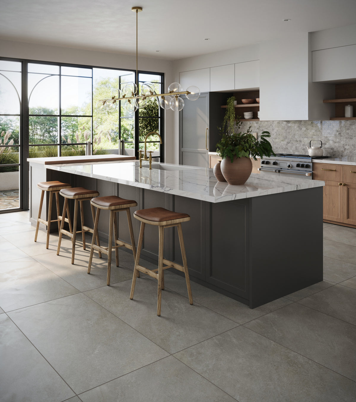 Modern kitchen with a large marble island, dark cabinetry, and natural light streaming through black-framed windows.