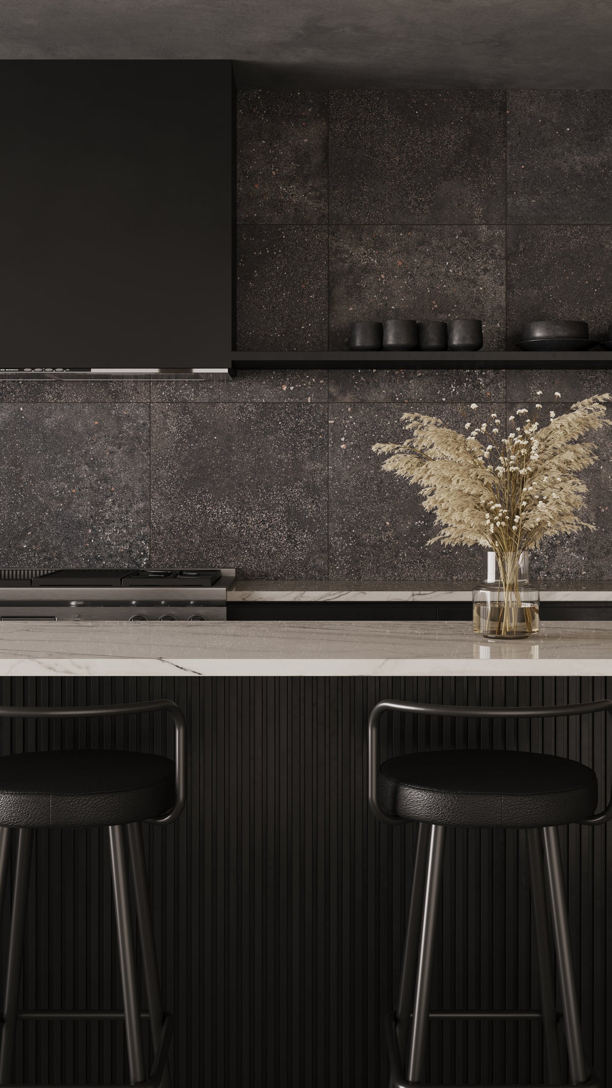 Modern kitchen featuring Sloane 24x24 matte porcelain tiles in Charcoal as a dramatic backdrop, complementing the sleek black cabinetry and marble countertop.