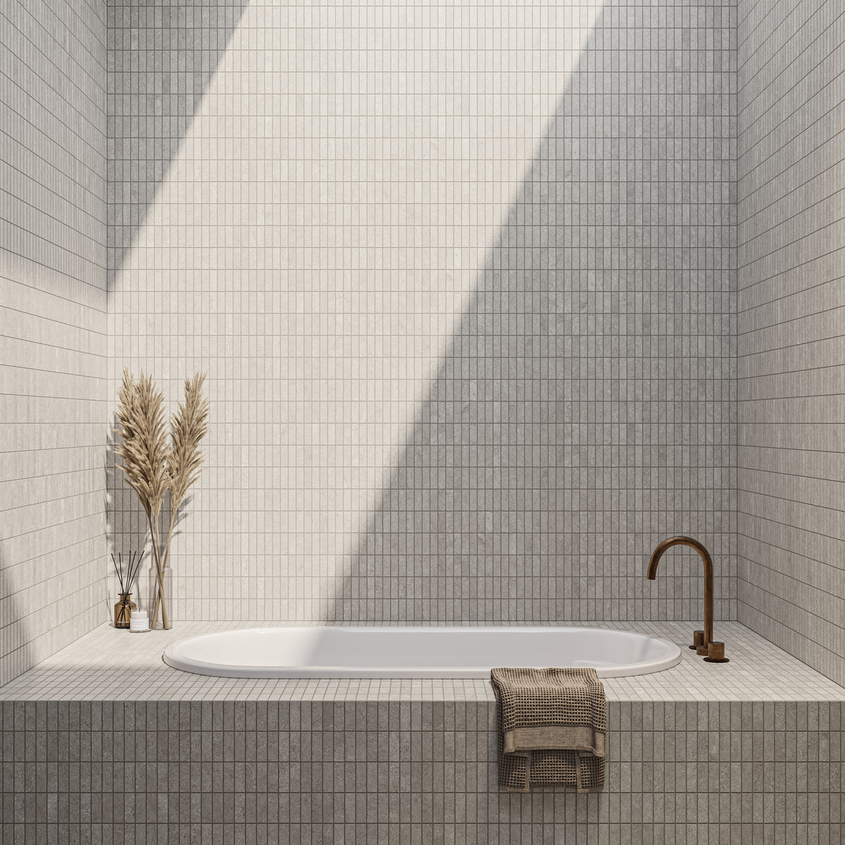 A serene bathroom featuring taupe matte mosaic tiles, a built-in tub with clean lines, and a minimalistic faucet under soft natural light.