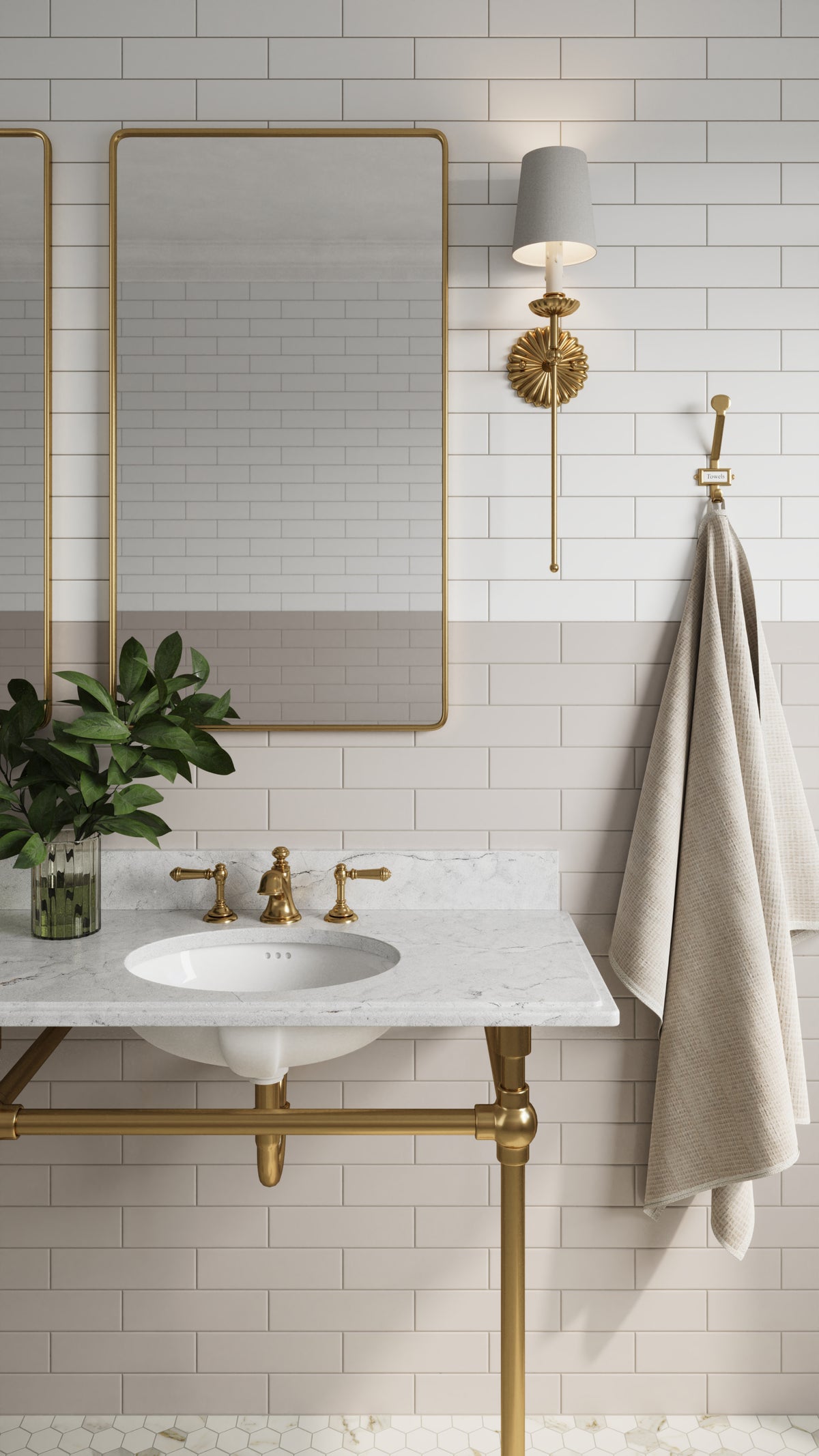 Refined bathroom design featuring Polly Beige 3x10 satin ceramic tiles in a two-tone pattern with Polly White tiles, complemented by brass accents, a marble vanity, and a hexagonal tile floor for timeless elegance.