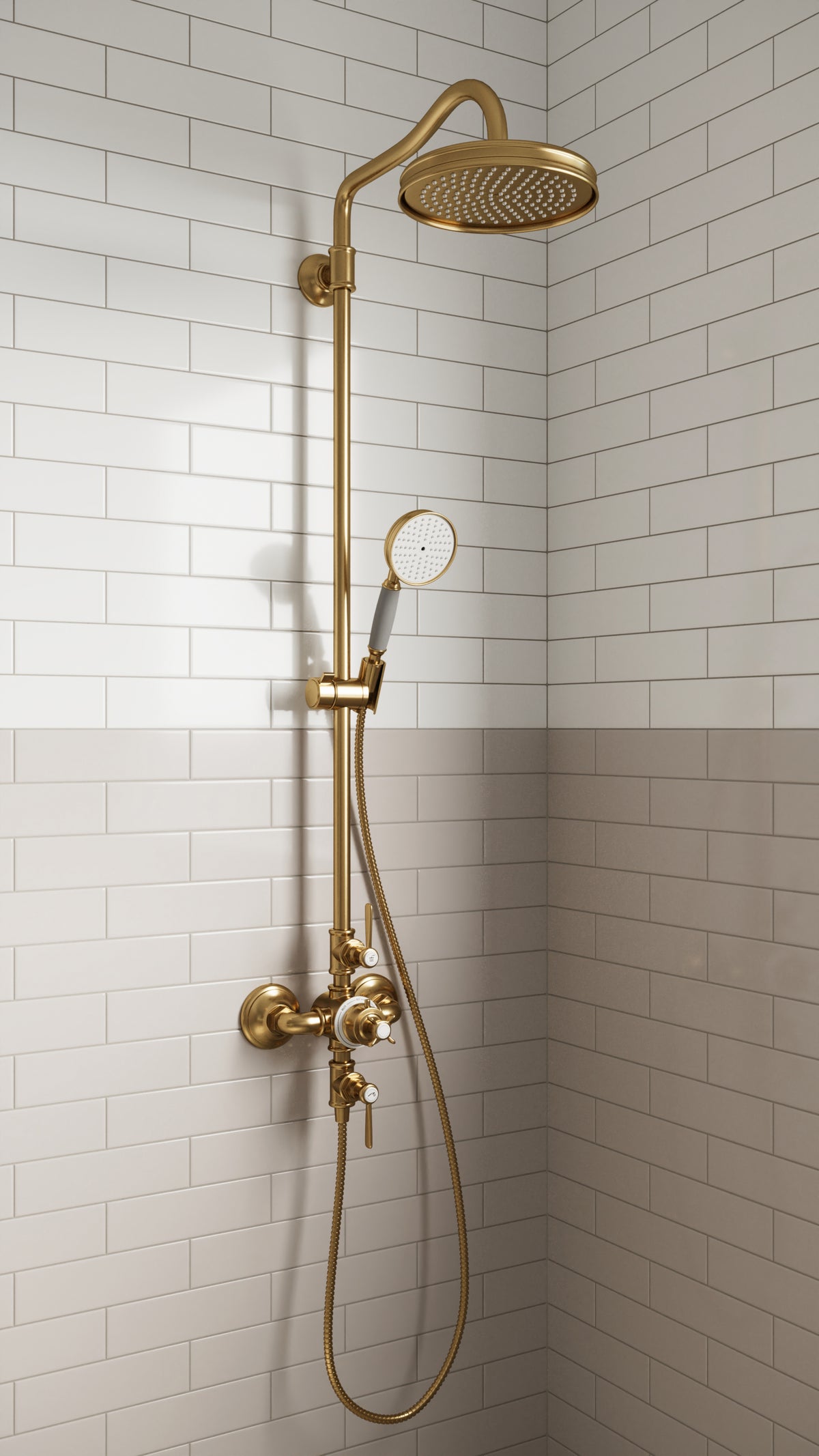 Luxurious shower space featuring Polly Beige 3x10 satin ceramic tiles in a two-tone design with Polly White tiles, complemented by elegant gold fixtures and a timeless subway tile pattern.