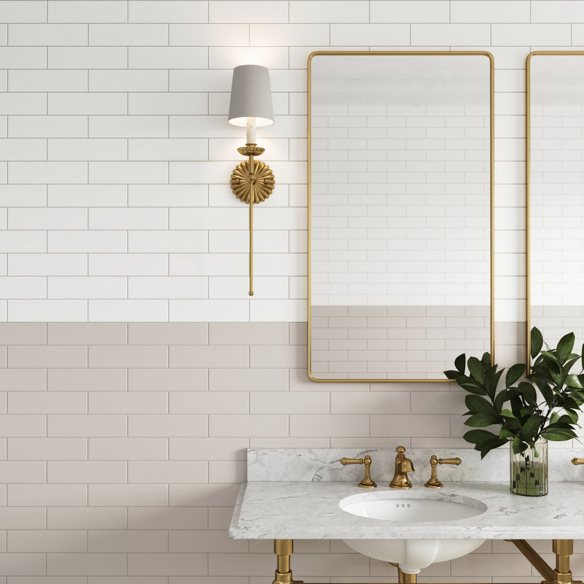 Elegant bathroom design featuring Polly 3x10 satin ceramic tiles in white, paired with gold fixtures and a marble vanity for a timeless, sophisticated look.