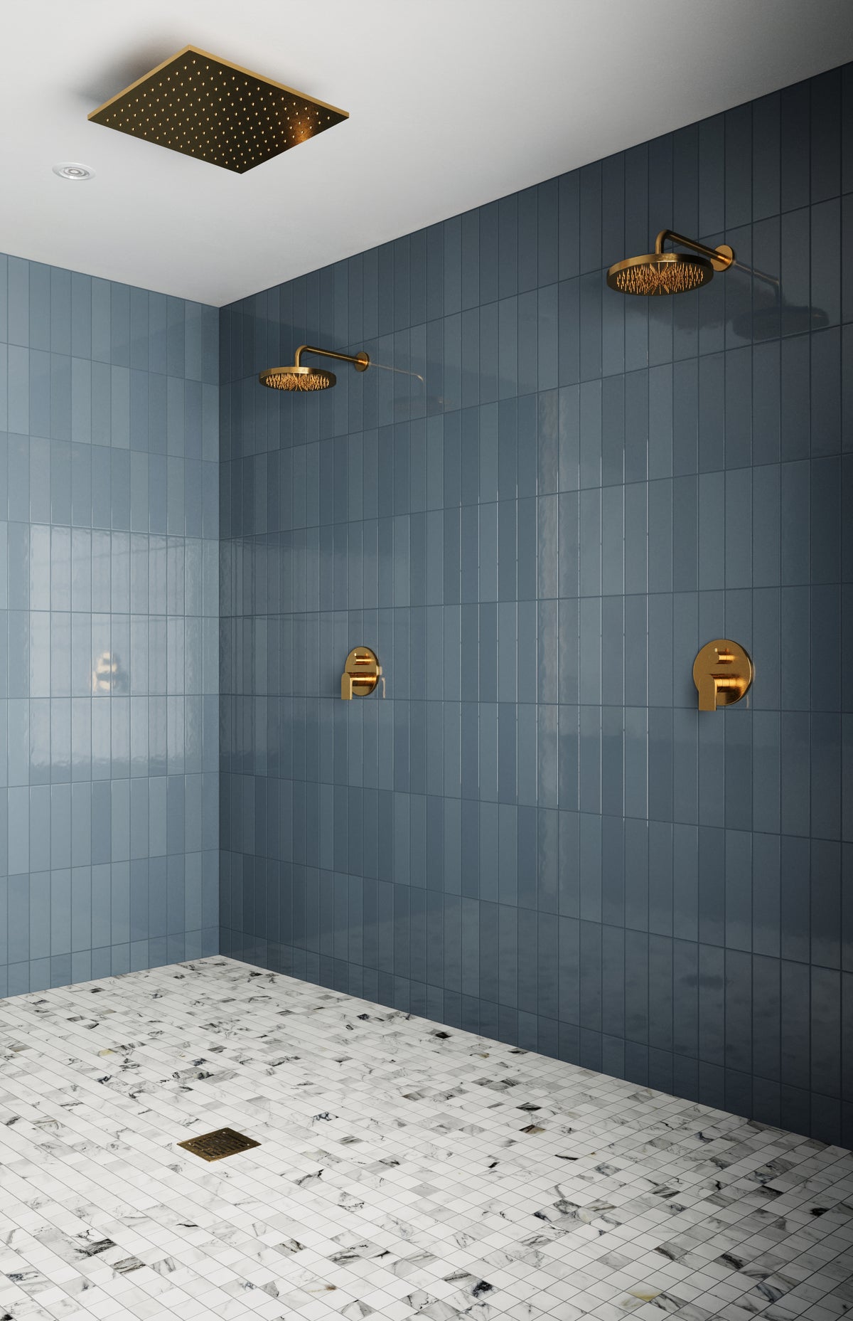 Modern shower featuring Teagan 3x12 glossy ceramic tiles in denim, accented by gold rain shower fixtures and marble mosaic flooring.
