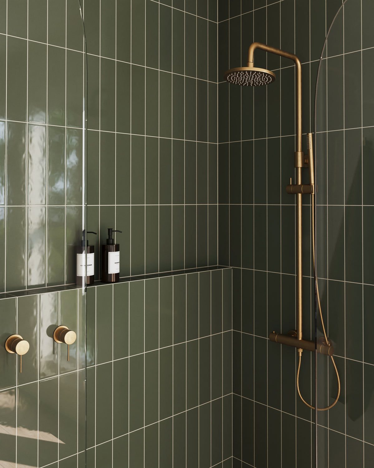 Modern shower showcasing Teagan 3x12 glossy ceramic tiles in moss green, paired with minimalist gold fixtures for an elegant touch.