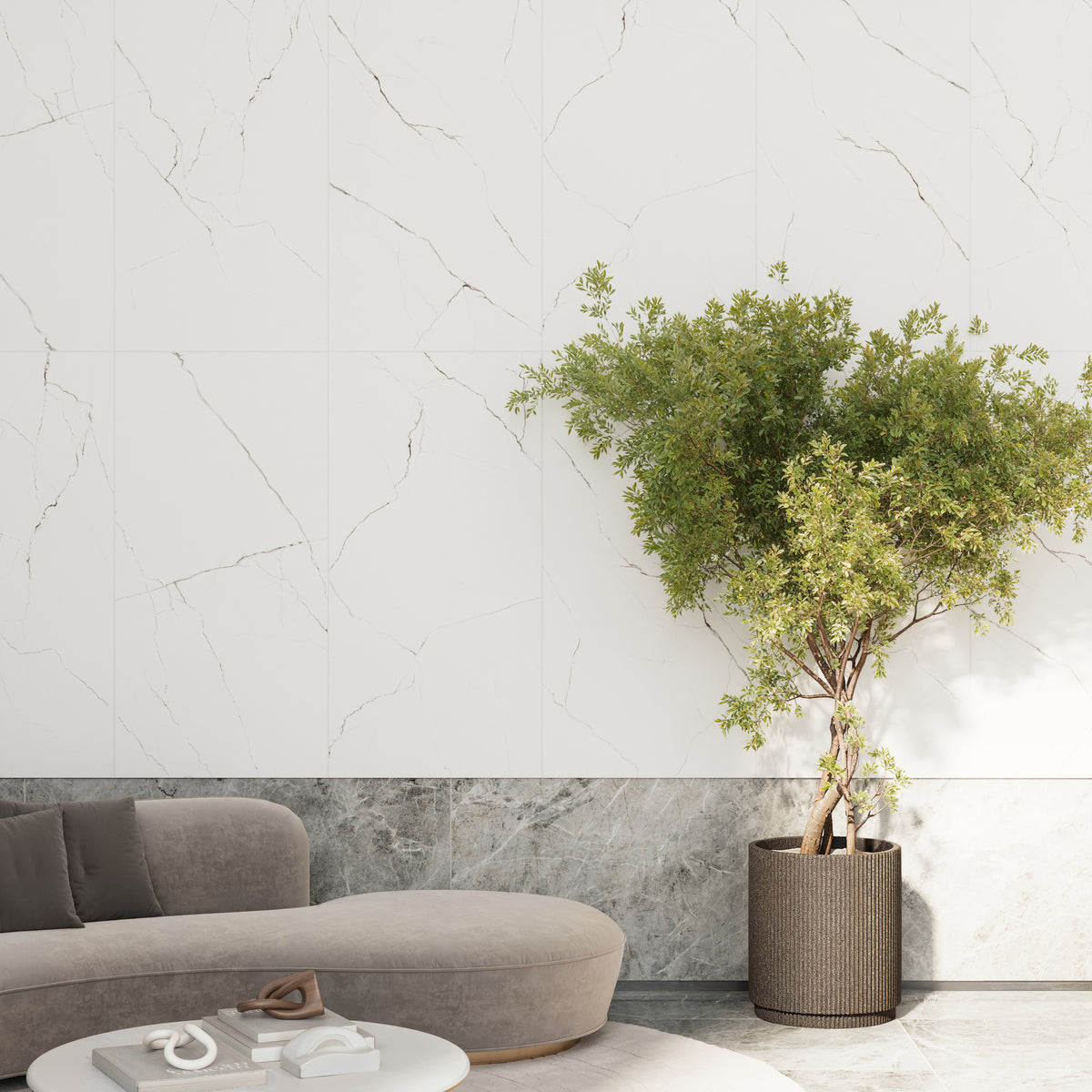 Living space featuring Natalia Calacatta Lincoln 24x48 matte tiles with subtle grey veining, paired with a modern sofa and potted greenery.