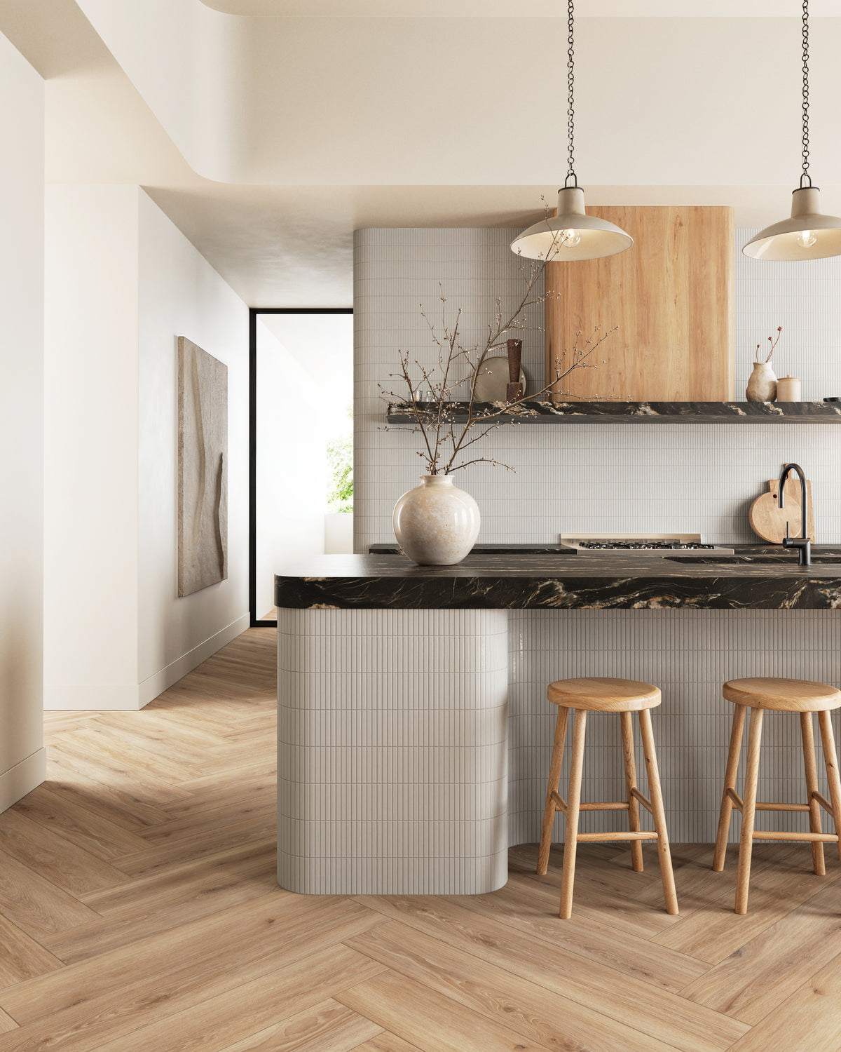 Modern kitchen featuring Miley white tiles with a sleek linear design, paired with a brown marble island and warm herringbone wood flooring