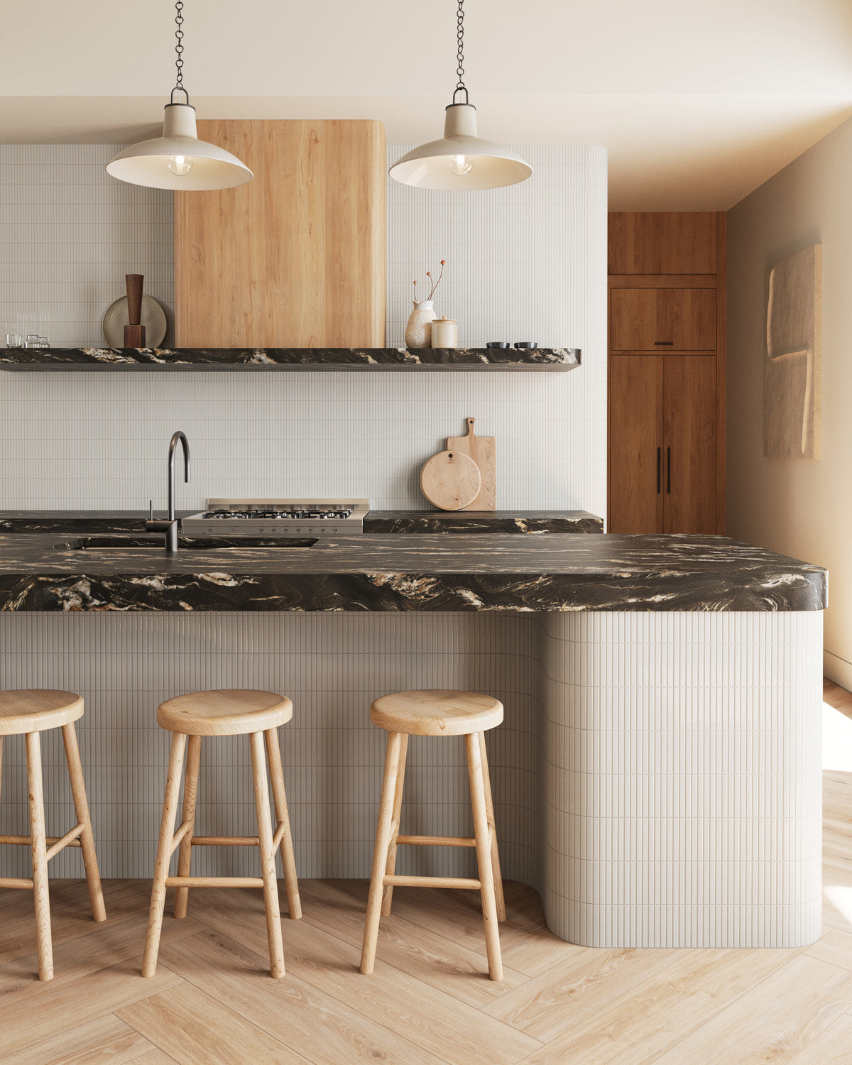 Modern kitchen featuring Jameson 8x48 matte porcelain tile in Camel, arranged in a herringbone pattern, paired with black marble countertops, curved island, and natural wood accents.