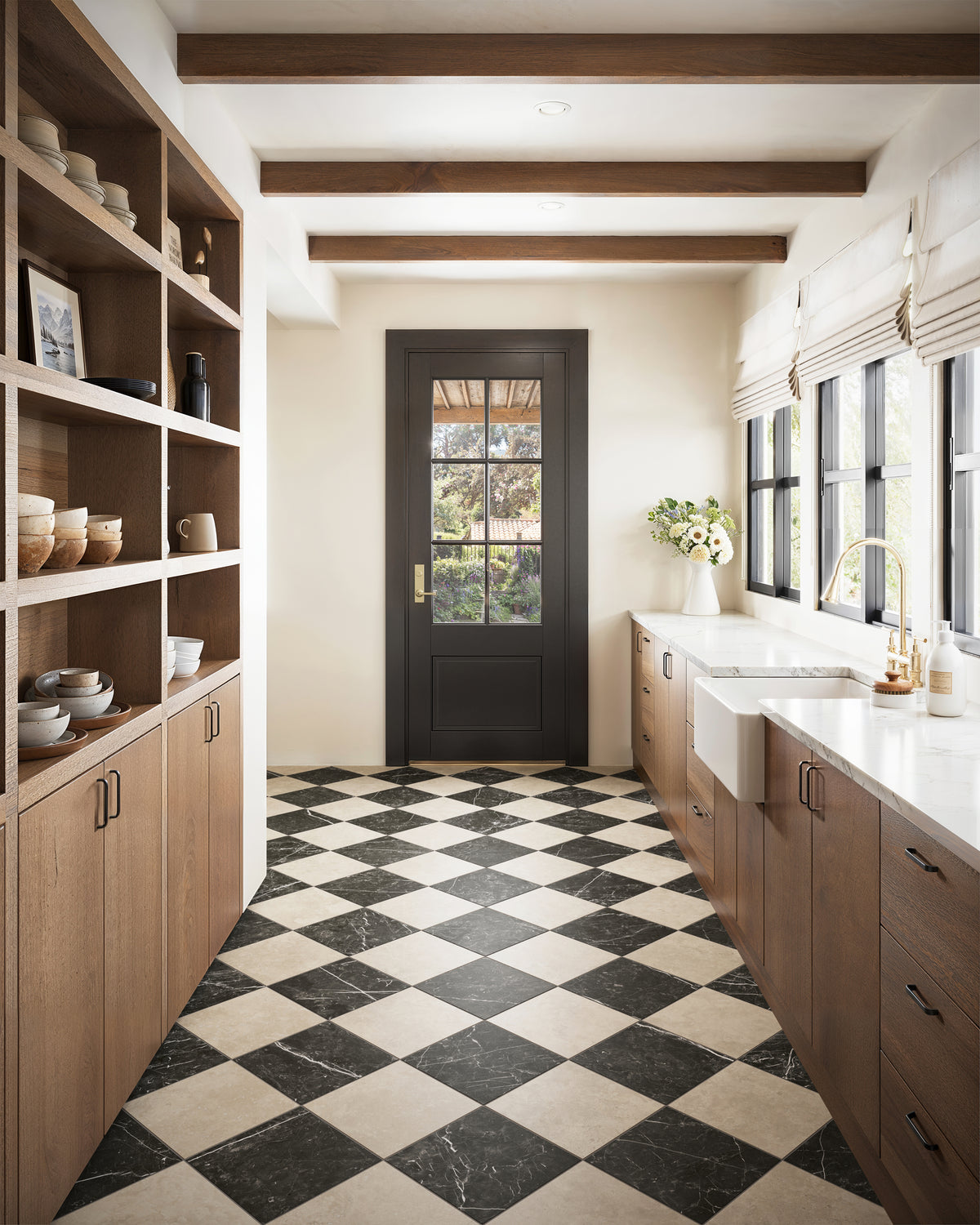 Leona 12x12 matte porcelain tile in Marfil and Nero Marquina, featuring soft beige and deep black marble-look tones in a striking checkerboard layout that elevates this modern galley kitchen.