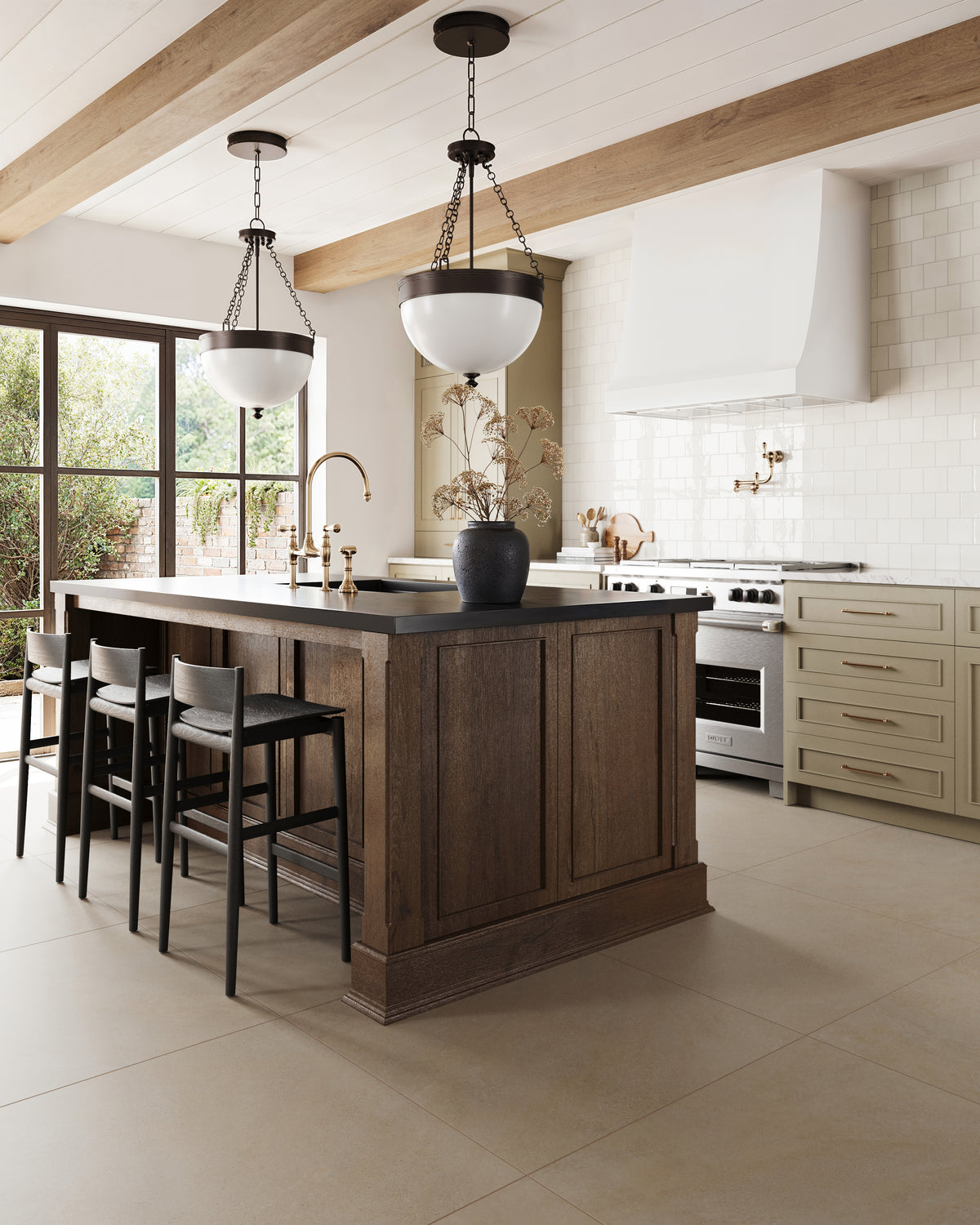 Bright traditional kitchen with wood island, olive cabinets, brass fixtures, and bronze pendant lights above glossy tile backsplash.
