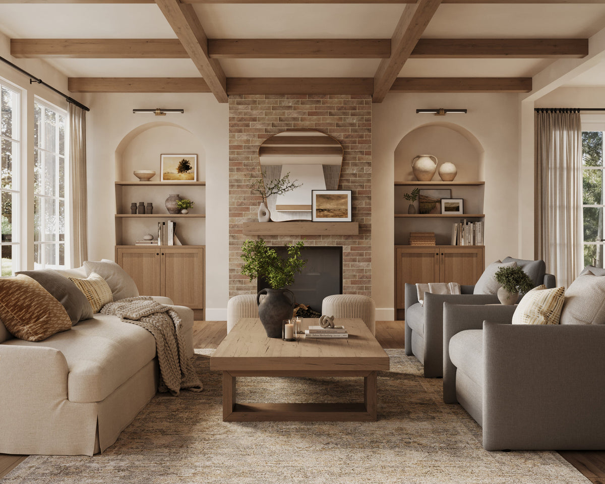 Inviting living room with almond-colored brick wall tiles on the fireplace, exposed wood beams, and neutral-toned furnishings that balance warmth and modern comfort.