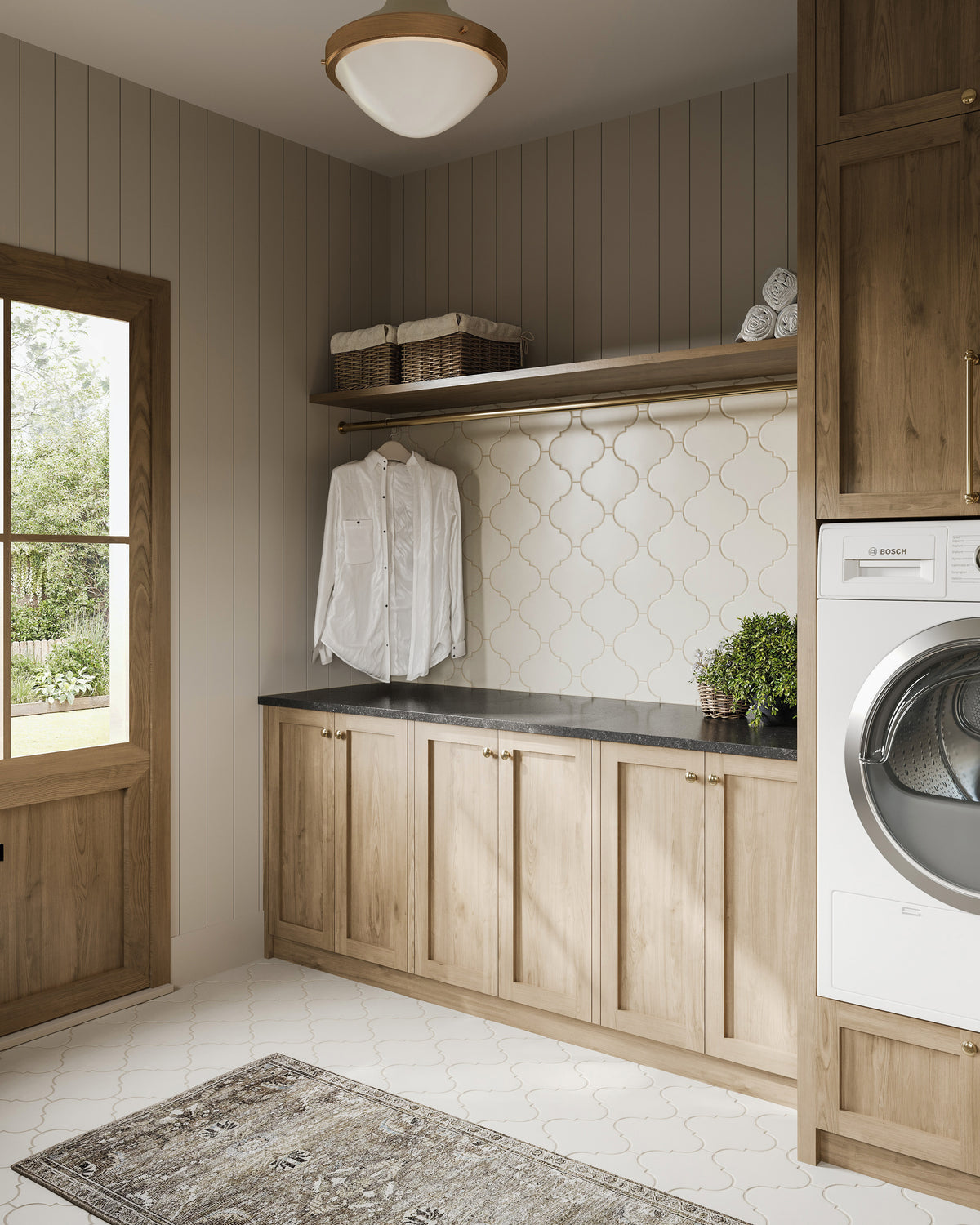 Laundry room with light wood cabinets and soft daylight, featuring Jasmine 8x8 white porcelain tile. The satin finish adds a velvety texture and enhanced slip resistance with a timeless lantern design.