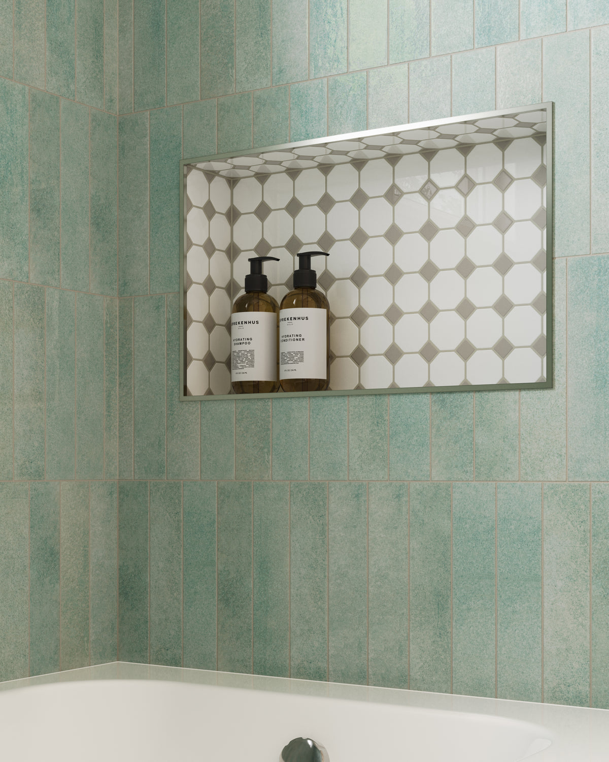 Seafoam glossy porcelain tiles surround a recessed shower niche, where their soft blue-green tones frame a patterned mosaic inset for a calm, Mediterranean-inspired bathroom look.
