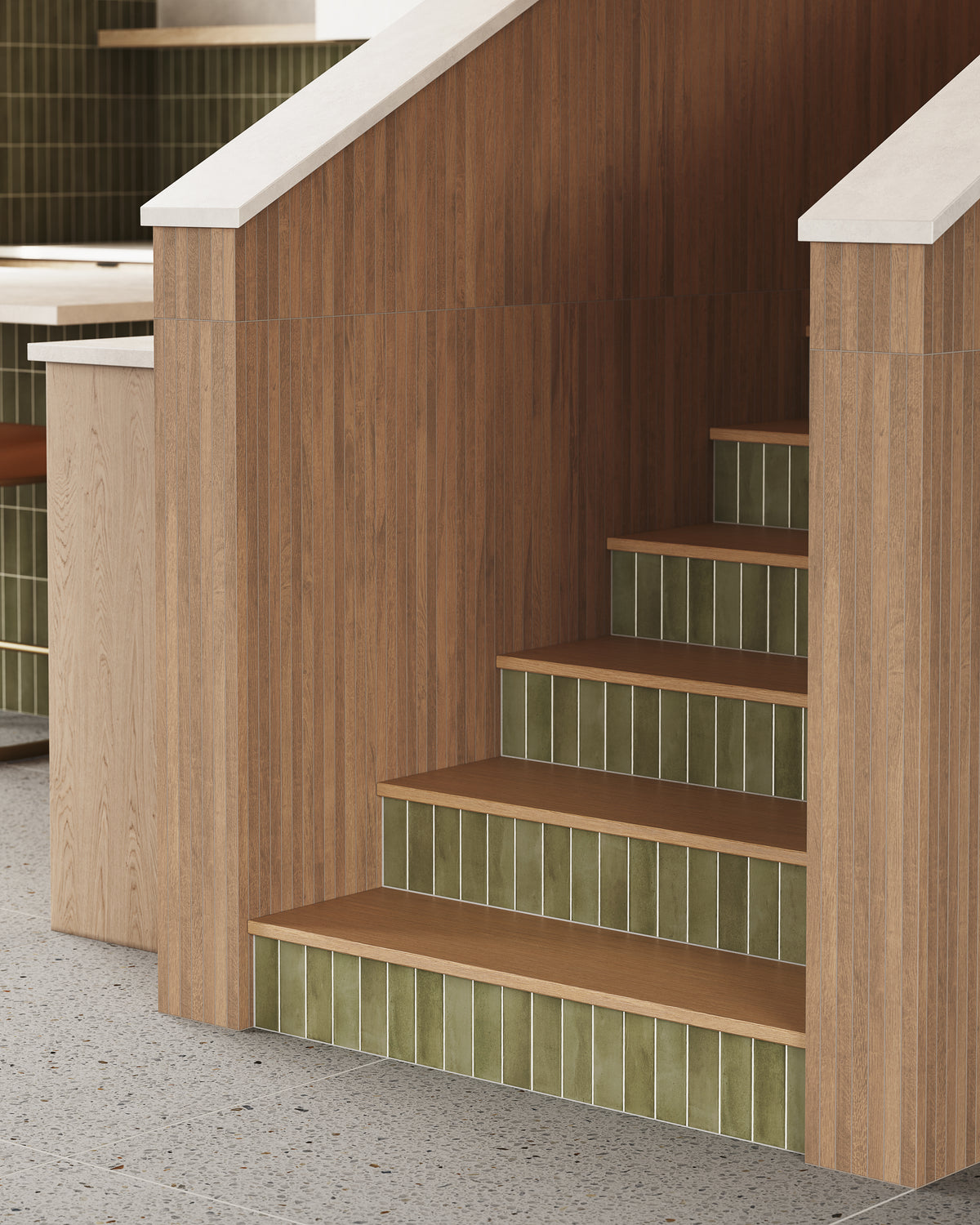 Porcelain wood-look 8x48 mosaic tile in a matte finish, vertically installed on stair walls for subtle texture and natural appeal.