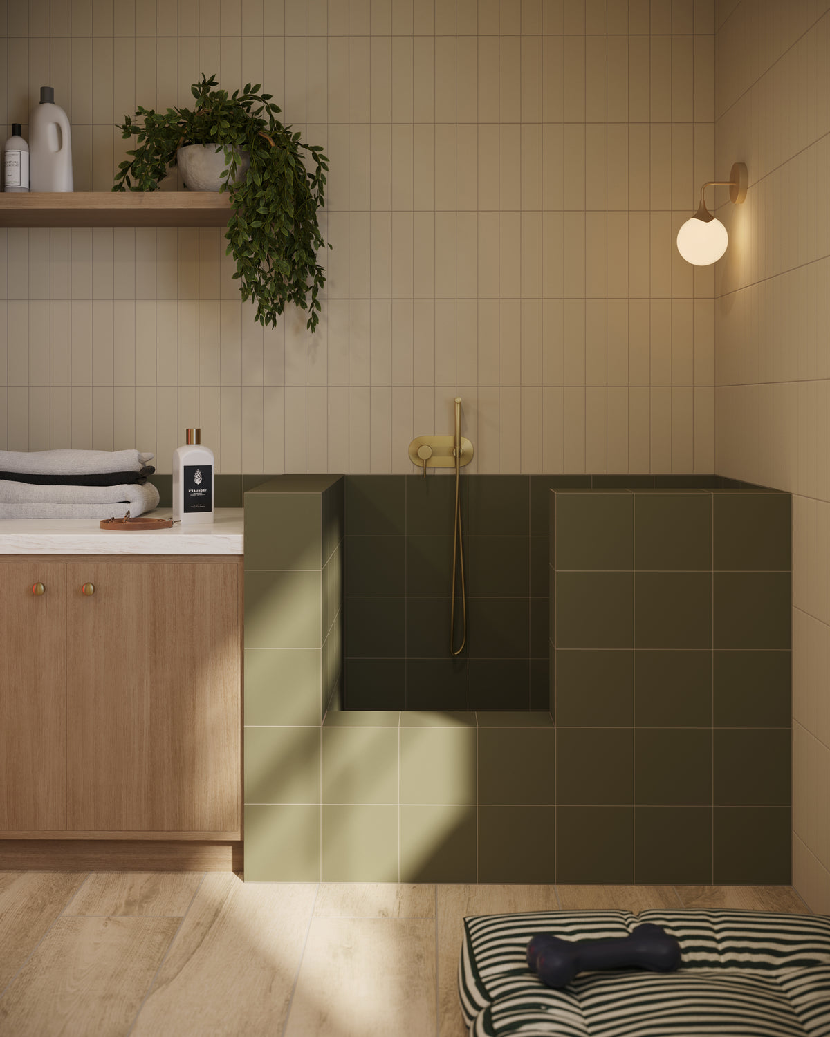 Pet wash station with matte olive green tiles, vertical beige wall subway tiles, light wood cabinetry, and soft natural lighting for a calming, functional space.