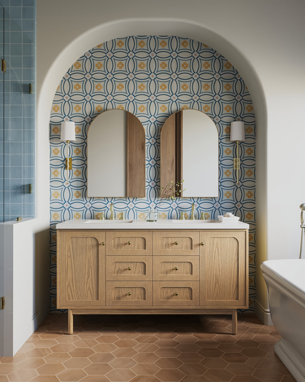 Abigail 60" double vanity in light natural oak, set against vibrant floral-patterned wall tiles under an arched niche.