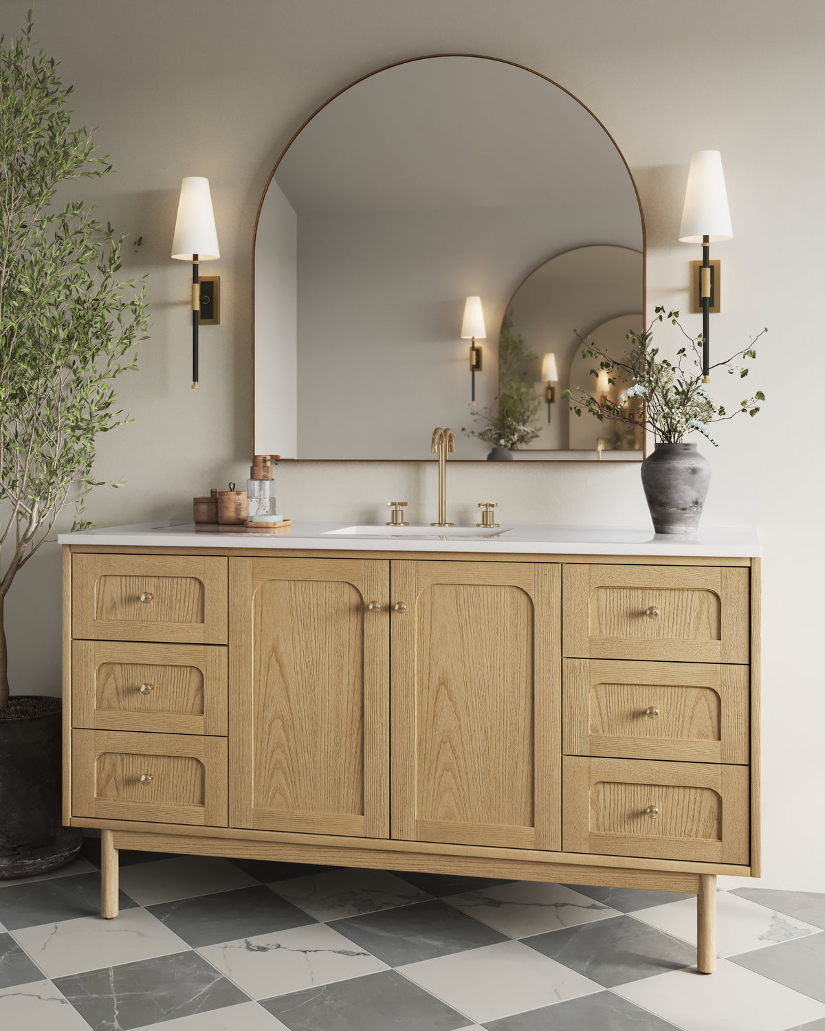 Wall sconce with tapered white linen shade, black and aged brass stem, and rectangular backplate flanking a large vanity mirror.