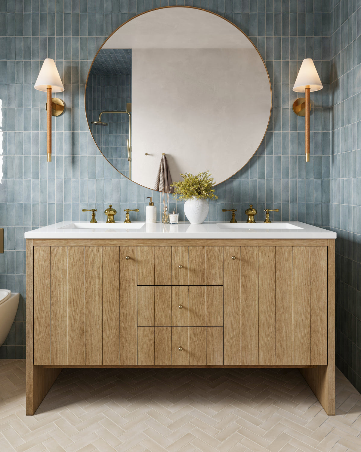 Light Natural Oak Gabriella 60" Double Vanity with quartz White Zeus top, fluted drawer front, and brass fittings, shown in a soft blue-tiled bathroom with warm accents.