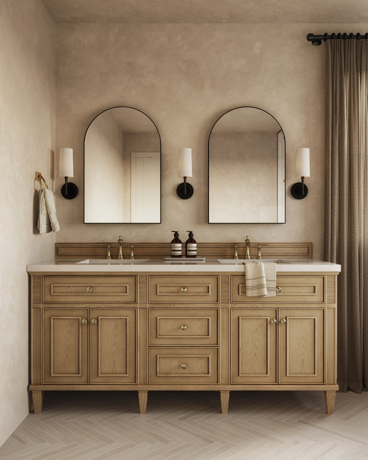 Eloide 72" double vanity in light natural oak with brass hardware, fluted accents, and dual sinks beneath black arched mirrors and wall sconces