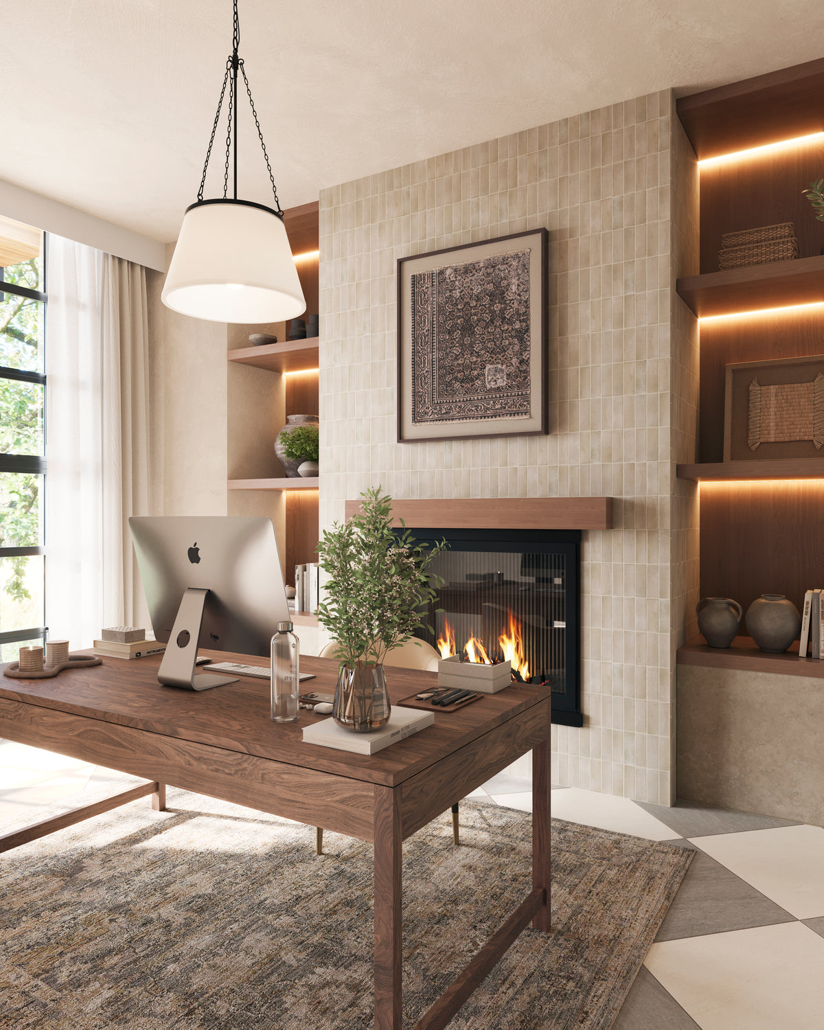 Warm modern home office with wood desk, pendant lighting, tiled fireplace wall, and framed textile art creating a refined, cozy workspace.