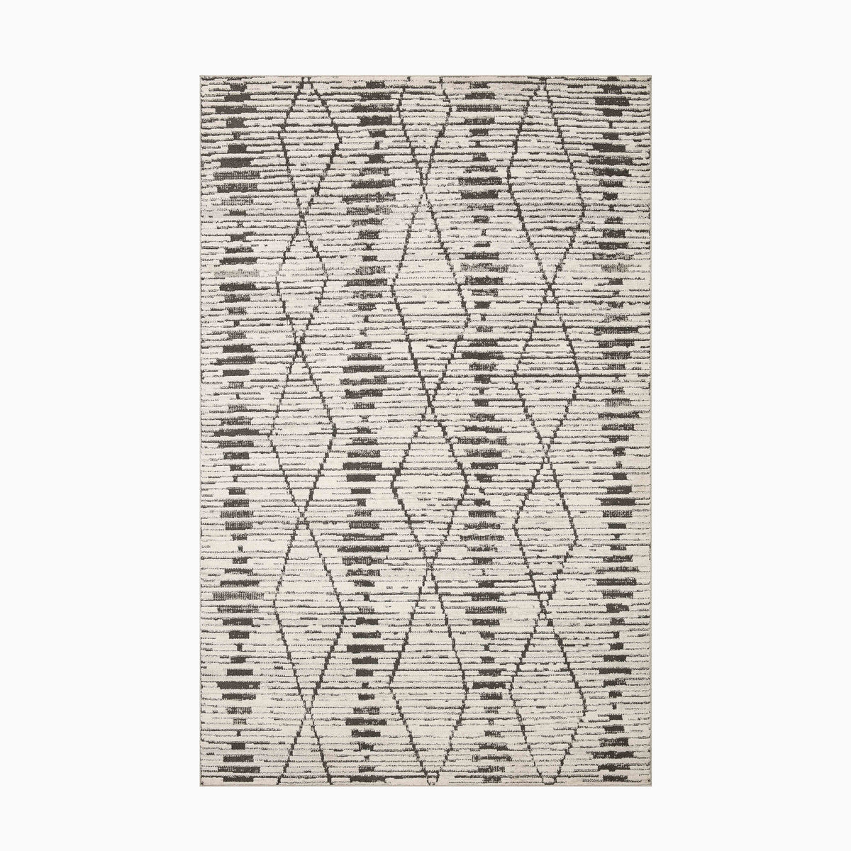 Power-loomed from durable polyester, this transitional rug features a soft platinum base with graphite geometric patterns, adding a modern touch.